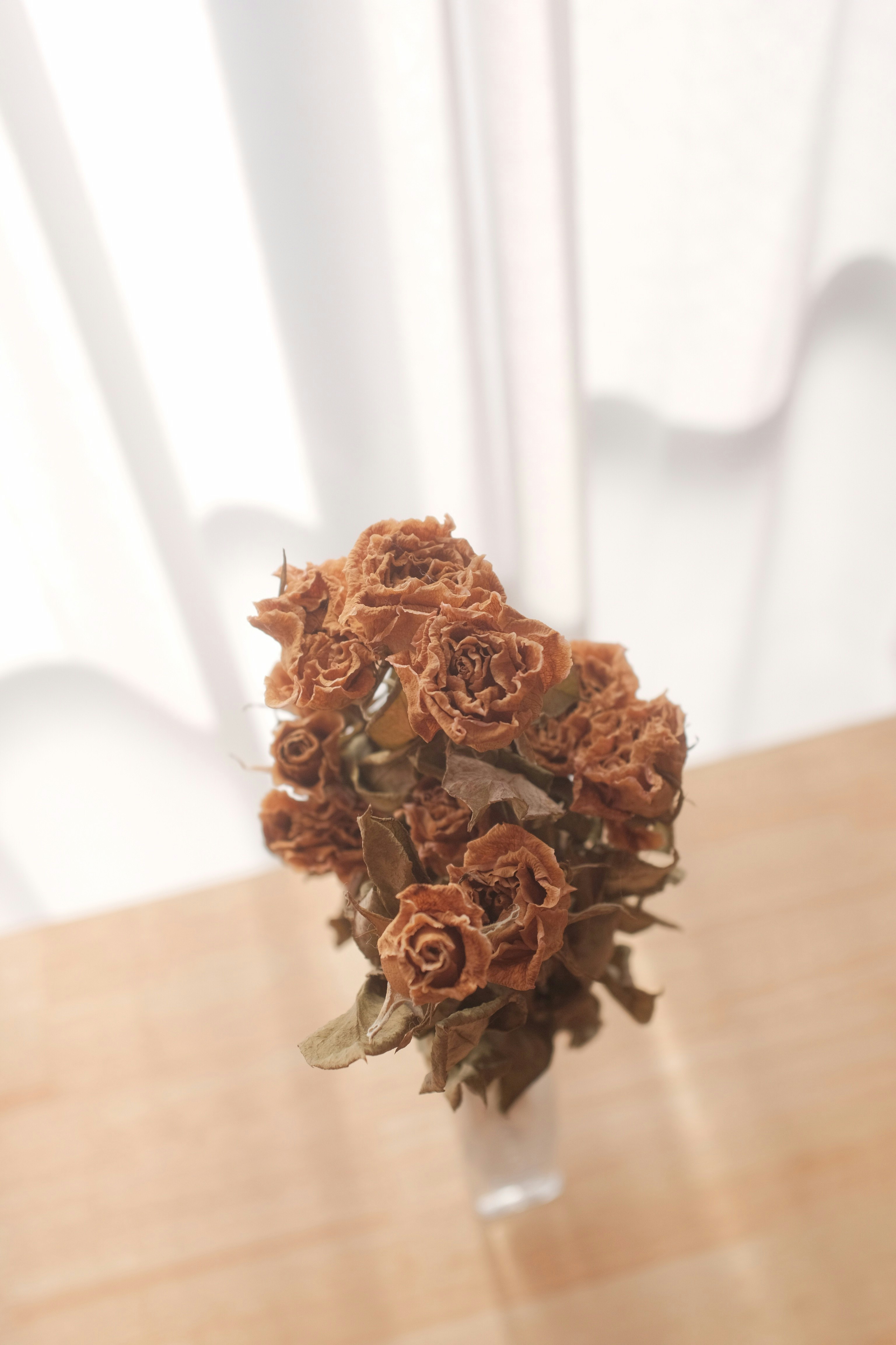 brown flower bouquet on brown wooden table
